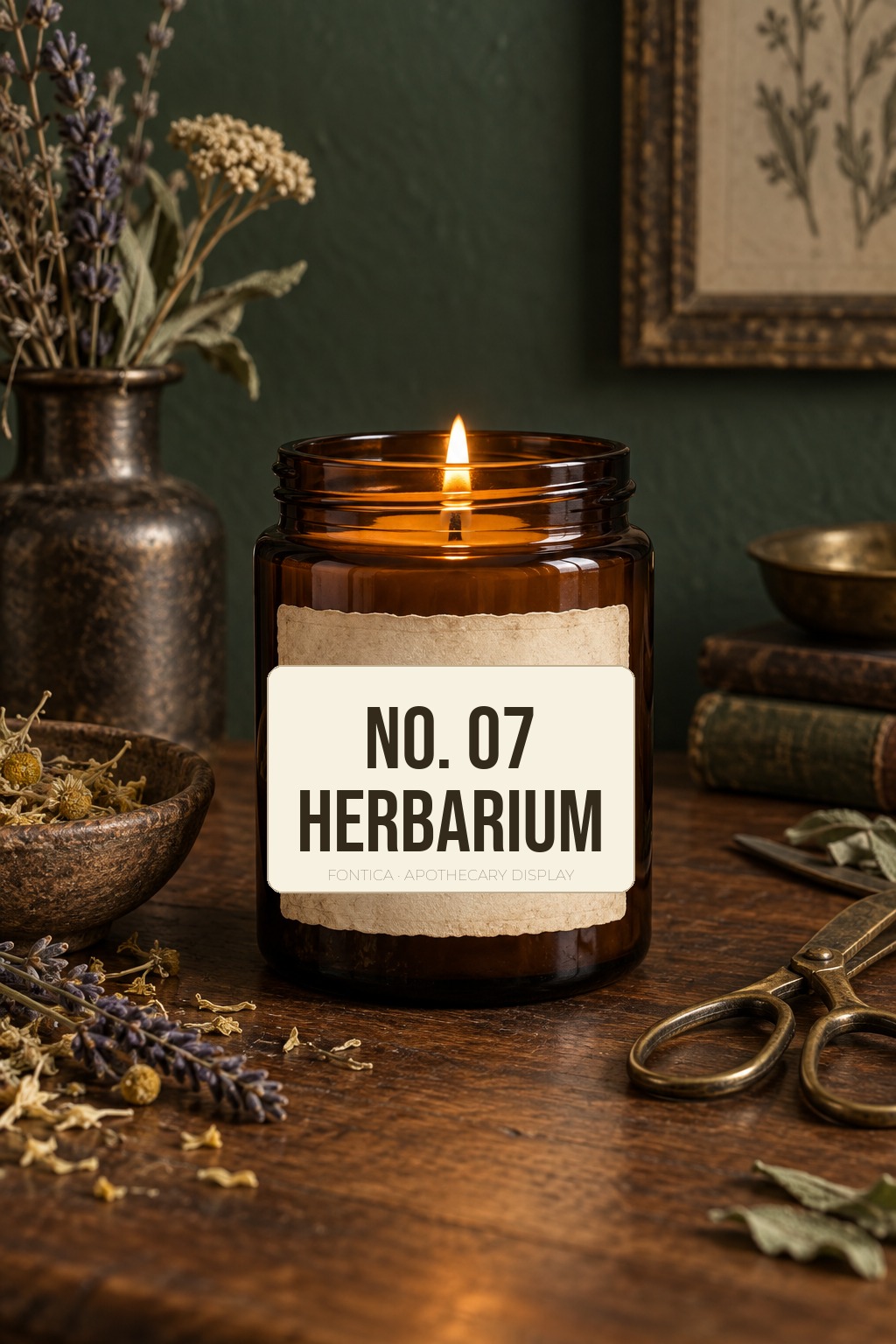 Herbarium apothecary candle label showing condensed display typography on an amber candle